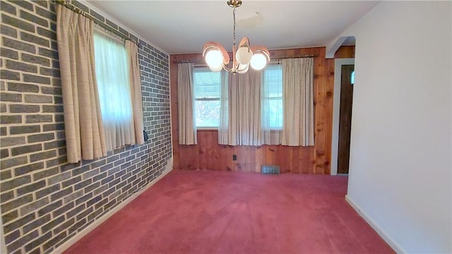 93 8th Ave, Ross Twp, PA 15229 - unfurnished dining area featuring a chandelier, wooden walls, and carpet floors