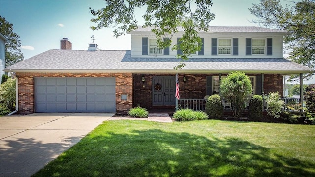 123 W Muntz Ave, Twp Of But Se, PA 16001 - view of front of property with brick siding, covered porch, driveway, a front yard, and an attached garage