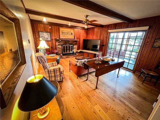 123 W Muntz Ave, Twp Of But Se, PA 16001 - living area featuring wood walls, light wood-type flooring, beam ceiling, ceiling fan, and a fireplace