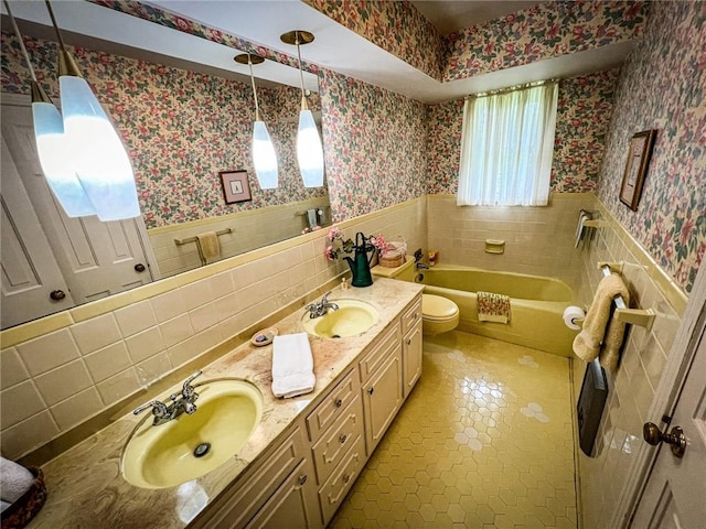123 W Muntz Ave, Twp Of But Se, PA 16001 - bathroom featuring wallpapered walls, a wainscoted wall, a garden tub, double vanity, and tile patterned flooring