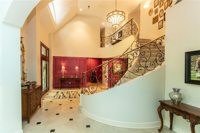 99 Wiggins Ln, South Union Twp, PA 15401 - entrance foyer with a towering ceiling, arched walkways, stairs, and a chandelier