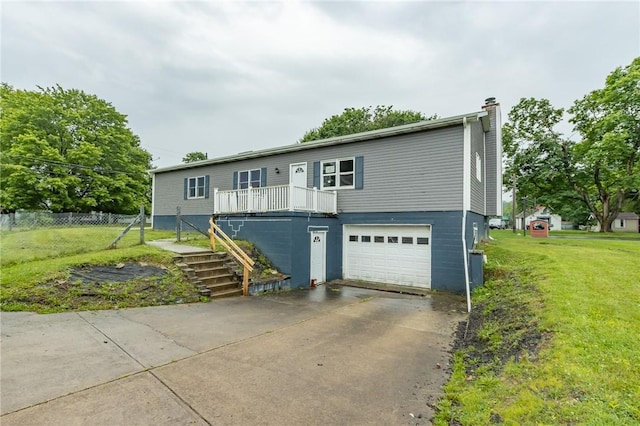 400 Moween Rd, Loyalhanna, PA 15681 - view of front of house featuring stairs, an attached garage, driveway, and a chimney