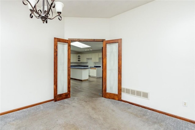 400 Moween Rd, Loyalhanna, PA 15681 - carpeted spare room with a chandelier and baseboards