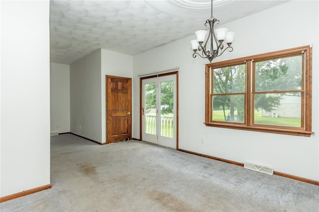 400 Moween Rd, Loyalhanna, PA 15681 - carpeted spare room featuring a chandelier and baseboards