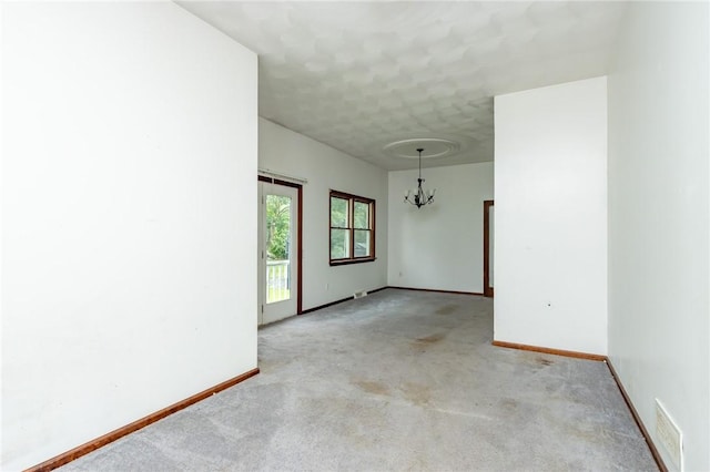 400 Moween Rd, Loyalhanna, PA 15681 - carpeted empty room with a chandelier and baseboards