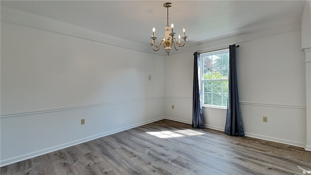 3011 Meyeridge Rd, Shaler, PA 15209 - spare room featuring a chandelier and wood finished floors