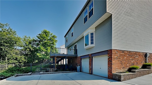 3011 Meyeridge Rd, Shaler, PA 15209 - view of property exterior featuring a garage, brick siding, concrete driveway, and stairway