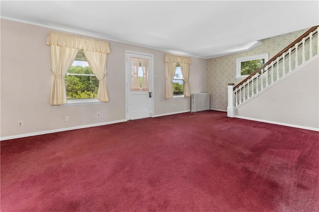 11 Old Mill Rd, Wharton Twp, PA 15470 - foyer entrance with radiator, healthy amount of natural light, stairs, carpet flooring, and wallpapered walls