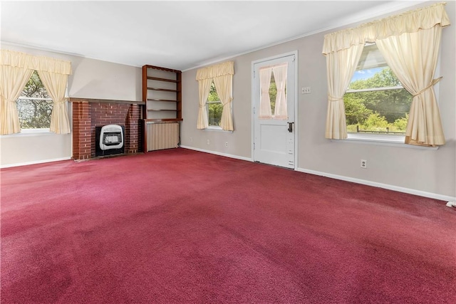 11 Old Mill Rd, Wharton Twp, PA 15470 - unfurnished living room featuring dark carpet, plenty of natural light, crown molding, and radiator