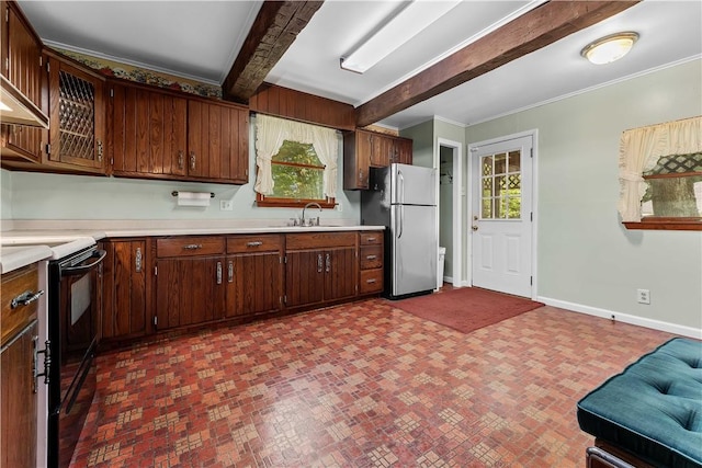 11 Old Mill Rd, Wharton Twp, PA 15470 - kitchen with black electric range oven, freestanding refrigerator, light countertops, healthy amount of natural light, and beamed ceiling