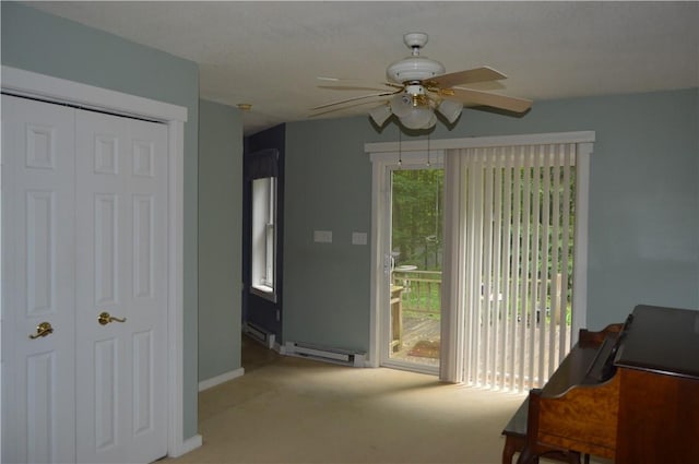 3244 Maple Ln, Jamestown Cra, PA 16134 - living area with a ceiling fan, light carpet, and a baseboard radiator