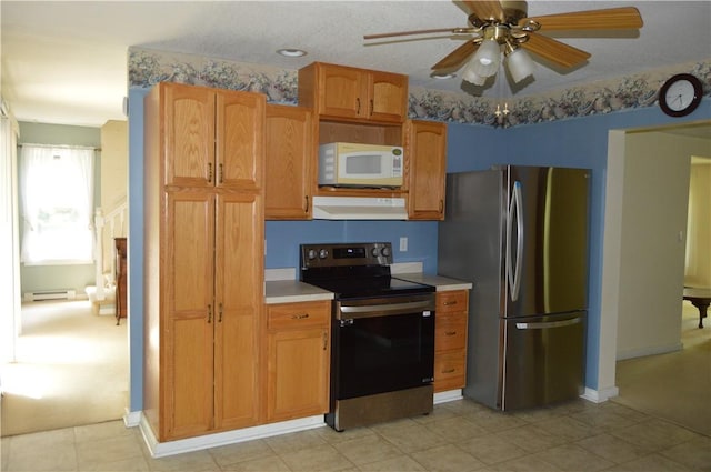 3244 Maple Ln, Jamestown Cra, PA 16134 - kitchen featuring appliances with stainless steel finishes, exhaust hood, baseboard heating, light countertops, and a ceiling fan