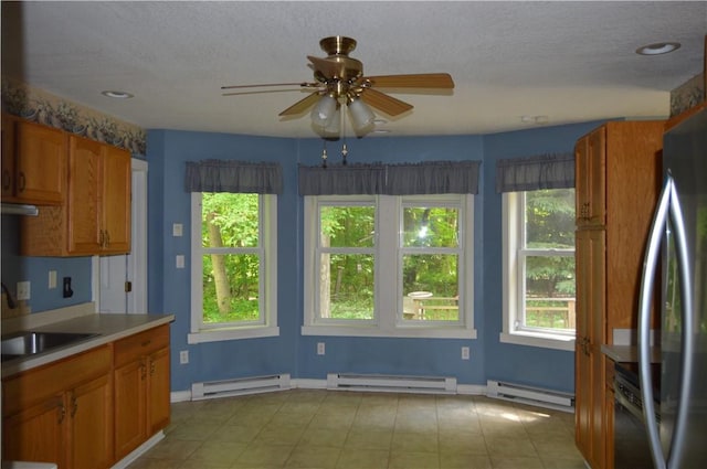 3244 Maple Ln, Jamestown Cra, PA 16134 - kitchen with a baseboard heating unit, plenty of natural light, and a textured ceiling