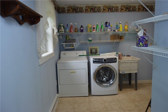 3244 Maple Ln, Jamestown Cra, PA 16134 - laundry area with washing machine and clothes dryer, light tile patterned flooring, and a baseboard heating unit