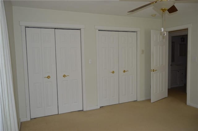 3244 Maple Ln, Jamestown Cra, PA 16134 - unfurnished bedroom with two closets, light colored carpet, and ceiling fan
