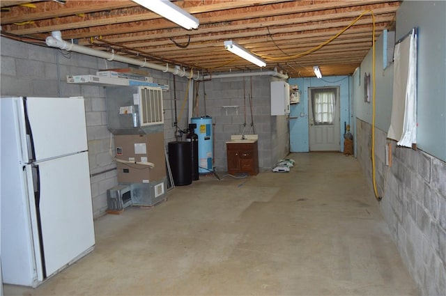 3244 Maple Ln, Jamestown Cra, PA 16134 - below grade area with freestanding refrigerator, water heater, concrete block wall, heating unit, and a water softener system