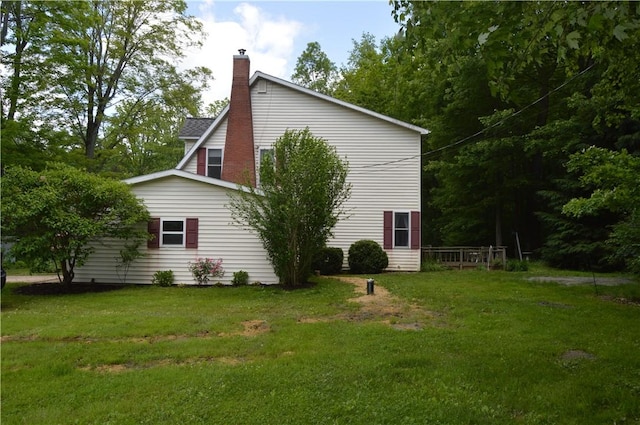 3244 Maple Ln, Jamestown Cra, PA 16134 - view of side of home with a lawn and a chimney
