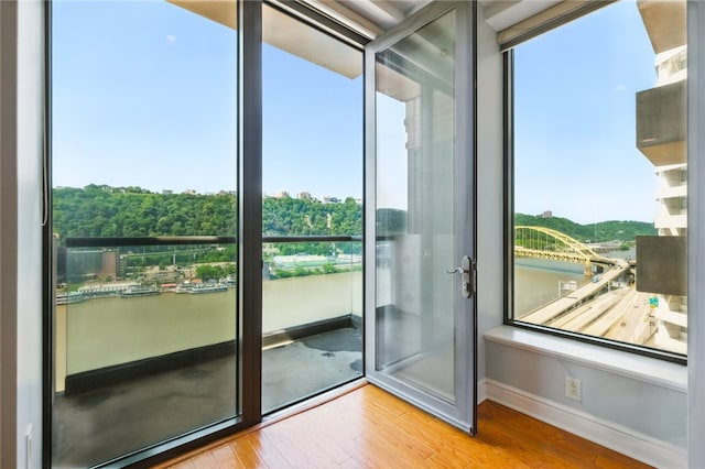 151 Fort Pitt Blvd Unit 1403, Downtown Pgh, PA 15222 - doorway to outside featuring wood finished floors and a water view