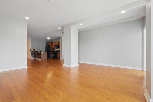 151 Fort Pitt Blvd Unit 1403, Downtown Pgh, PA 15222 - unfurnished living room featuring light wood finished floors and recessed lighting