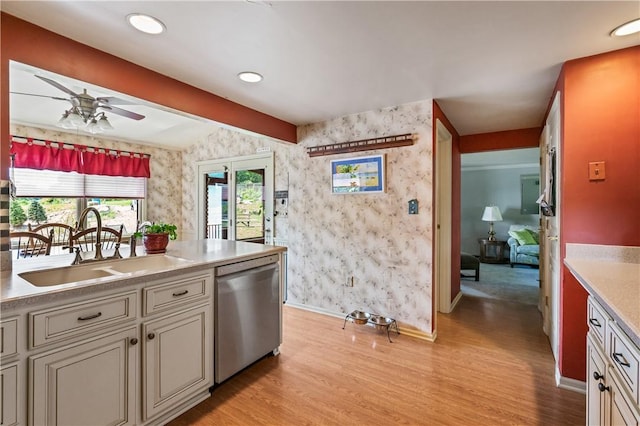 401 Middlesex Rd, Elizabeth Twp/Boro, PA 15135 - kitchen featuring stainless steel dishwasher, wallpapered walls, light wood-style floors, a ceiling fan, and light countertops