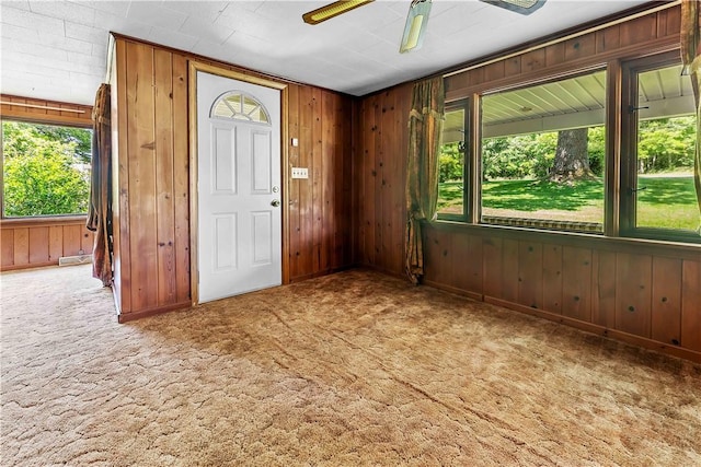154 Burke Rd, Wharton Twp, PA 15437 - carpeted entrance foyer featuring ceiling fan and wood walls
