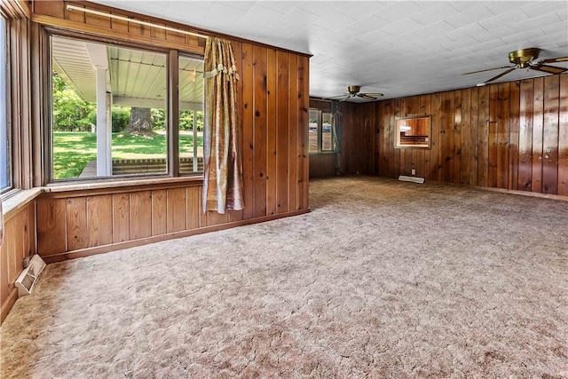 154 Burke Rd, Wharton Twp, PA 15437 - empty room with a ceiling fan, wooden walls, and carpet floors