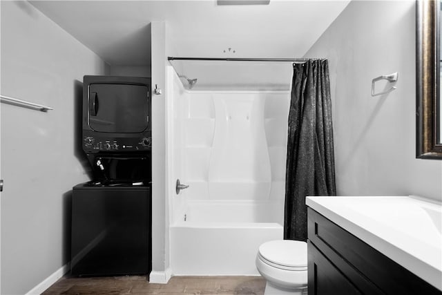 295 Holland Ct, Findlay Twp, PA 15108 - bathroom with stacked washer and clothes dryer, shower / bath combo with shower curtain, vanity, and wood finished floors