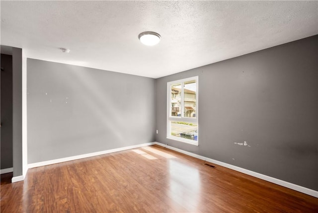 295 Holland Ct, Findlay Twp, PA 15108 - unfurnished room with wood finished floors and a textured ceiling