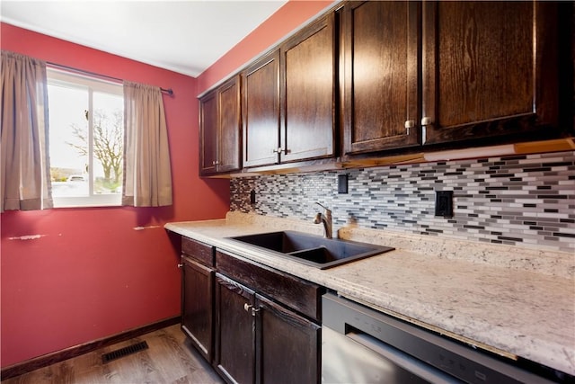295 Holland Ct, Findlay Twp, PA 15108 - kitchen featuring stainless steel dishwasher, tasteful backsplash, wood finished floors, and dark brown cabinets