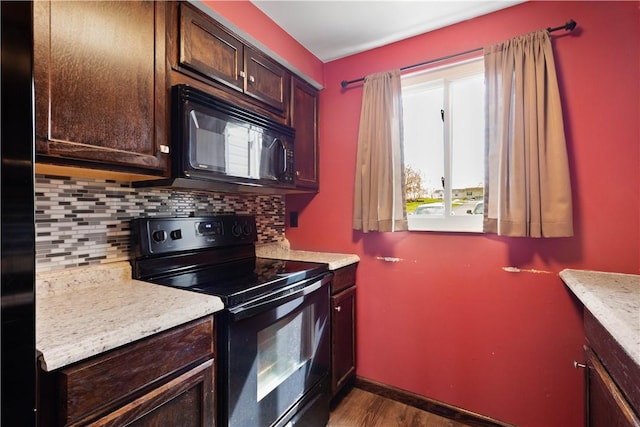 295 Holland Ct, Findlay Twp, PA 15108 - kitchen featuring black appliances, tasteful backsplash, light countertops, dark brown cabinetry, and dark wood-style floors