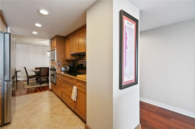 1 Trimont Ln Unit 620B, Mt Washington, PA 15211 - kitchen with appliances with stainless steel finishes, brown cabinets, recessed lighting, under cabinet range hood, and light wood-type flooring