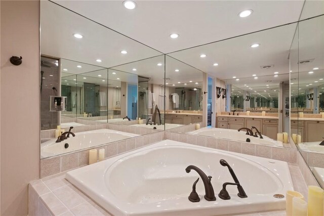 1 Trimont Ln Unit 620B, Mt Washington, PA 15211 - bathroom featuring a garden tub, vanity, and recessed lighting