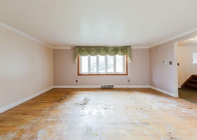 155 Greylock Dr, Penn Hills, PA 15235 - empty room featuring plenty of natural light, ornamental molding, wood finished floors, and stairs