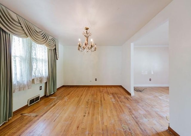 155 Greylock Dr, Penn Hills, PA 15235 - unfurnished dining area featuring a chandelier and light wood-type flooring