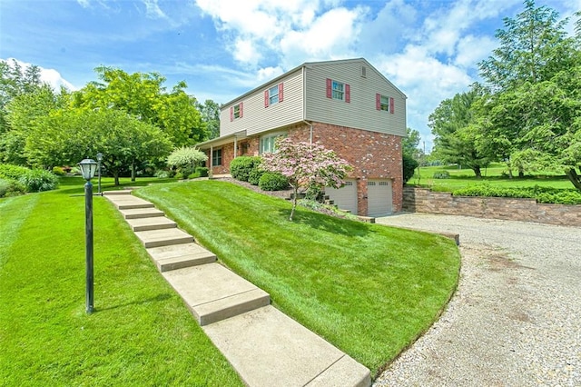 4032 Sardis Rd, Murrysville, PA 15668 - view of front of home featuring brick siding, a garage, driveway, and a front yard