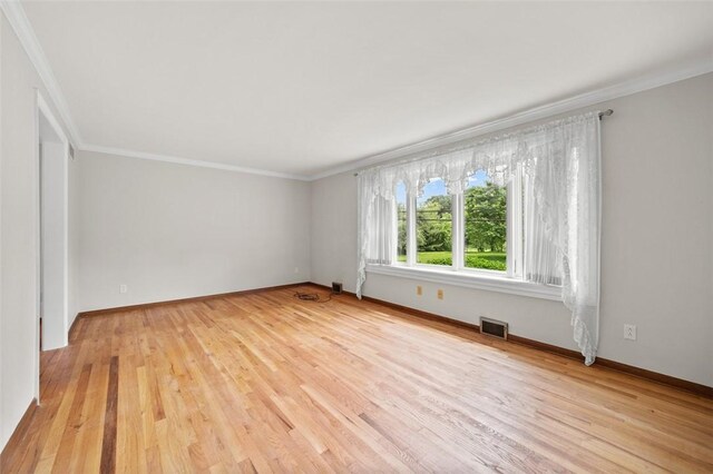 4032 Sardis Rd, Murrysville, PA 15668 - empty room with light wood finished floors and ornamental molding