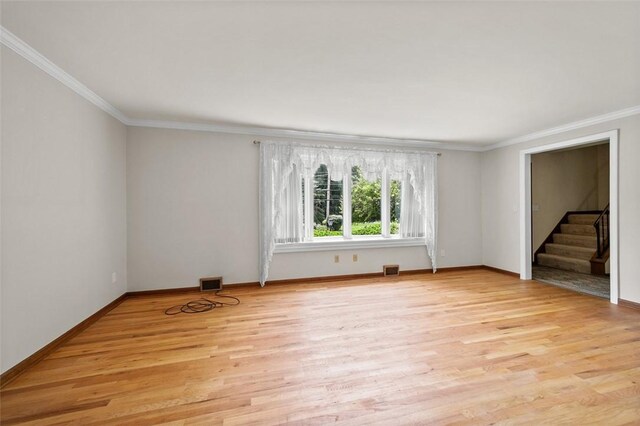 4032 Sardis Rd, Murrysville, PA 15668 - spare room featuring crown molding, stairs, and light wood-type flooring