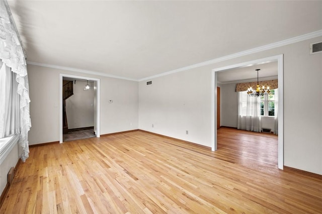 4032 Sardis Rd, Murrysville, PA 15668 - empty room featuring a chandelier, crown molding, and light wood-type flooring