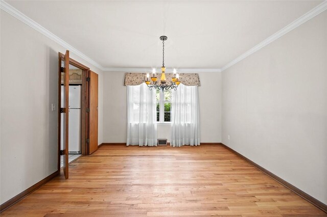 4032 Sardis Rd, Murrysville, PA 15668 - unfurnished dining area featuring a chandelier, light wood-style flooring, and ornamental molding