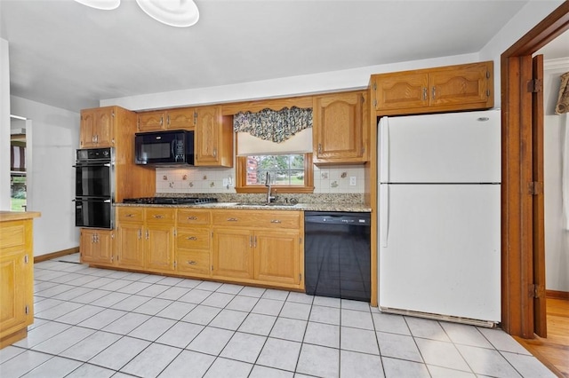 4032 Sardis Rd, Murrysville, PA 15668 - kitchen with black appliances, decorative backsplash, light tile patterned floors, and light stone counters
