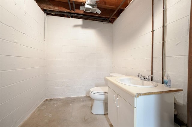 4032 Sardis Rd, Murrysville, PA 15668 - bathroom with vanity, concrete floors, and concrete block wall