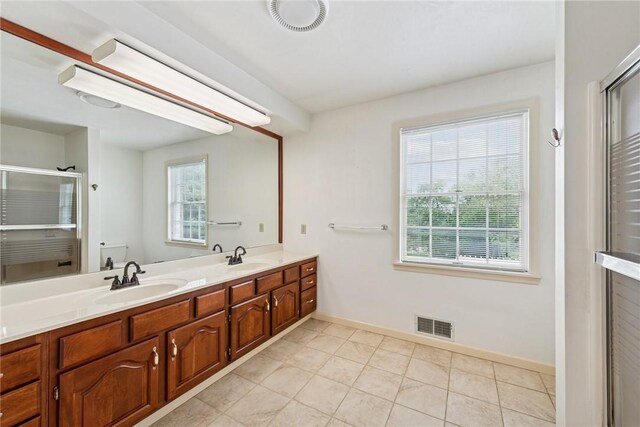 616 Edwards, Derry Twp, PA 15650 - full bath with a shower stall, double vanity, and tile patterned floors