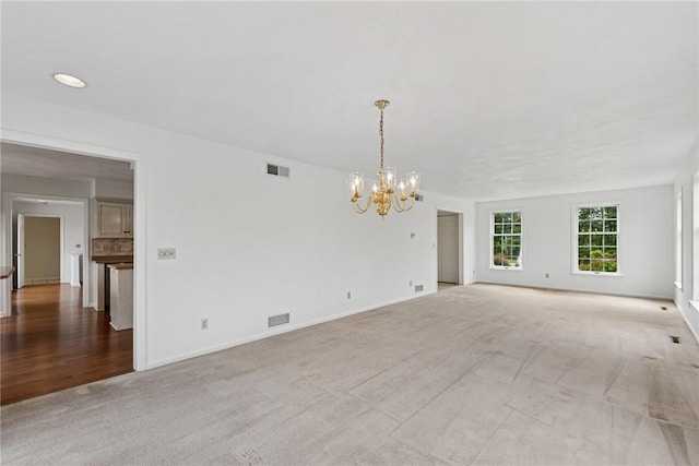 616 Edwards, Derry Twp, PA 15650 - carpeted spare room featuring a chandelier and baseboards