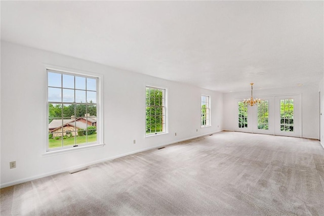 616 Edwards, Derry Twp, PA 15650 - empty room with a chandelier and light colored carpet