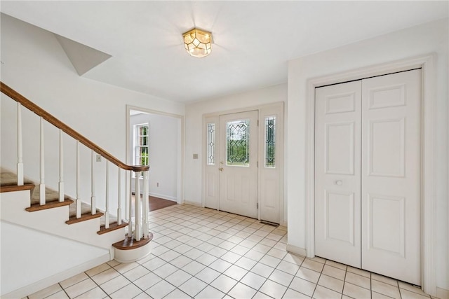 616 Edwards, Derry Twp, PA 15650 - foyer entrance featuring stairway and light tile patterned flooring