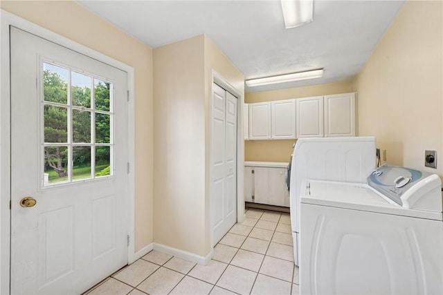 616 Edwards, Derry Twp, PA 15650 - laundry area with cabinet space, light tile patterned floors, healthy amount of natural light, and separate washer and dryer