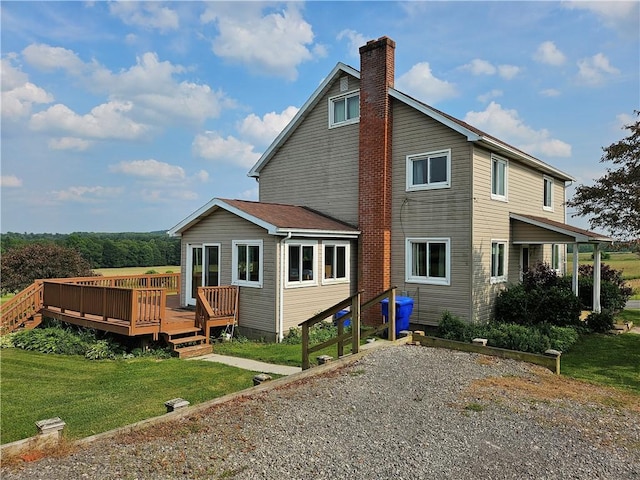 169 Fergus Rd, Slippery Rock Twp But, PA 16057 - back of house featuring a chimney, a wooden deck, and a lawn