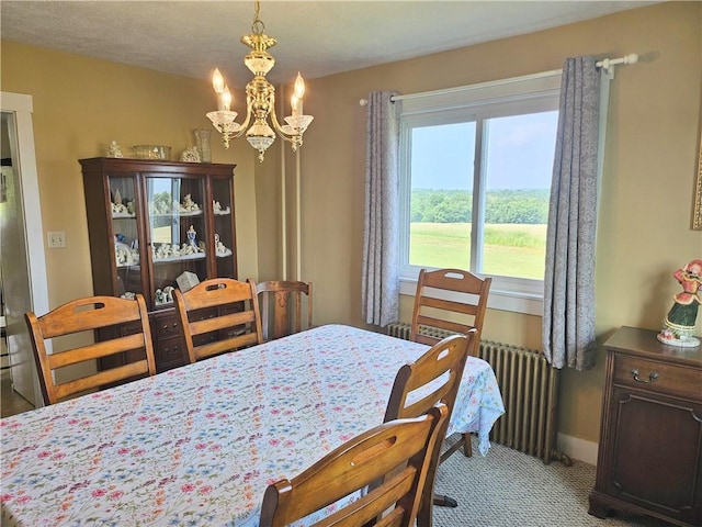 169 Fergus Rd, Slippery Rock Twp But, PA 16057 - carpeted dining area featuring a chandelier and baseboards