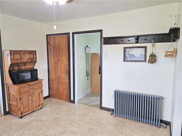 169 Fergus Rd, Slippery Rock Twp But, PA 16057 - living room with radiator, light colored carpet, and a ceiling fan
