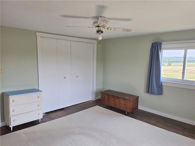 169 Fergus Rd, Slippery Rock Twp But, PA 16057 - unfurnished bedroom featuring dark wood-type flooring, a closet, and a ceiling fan
